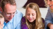 family-around-tablet